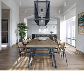 Chicago apartment for rent - A modern lounge dining room with a large table and chairs at Windsor North + Vine 633 W North Ave, Chicago, IL 60610.