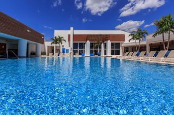 Rooftop infinity pool and hot tub with tons of seating options and lounge areas