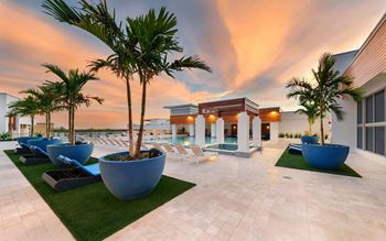 Rooftop infinity pool and hot tub with tons of seating options and lounge areas