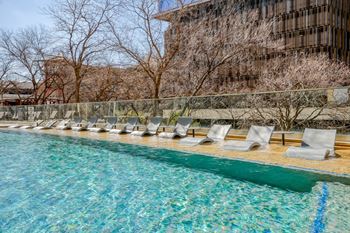 Elevated outdoor lounge with heated resort-style pool