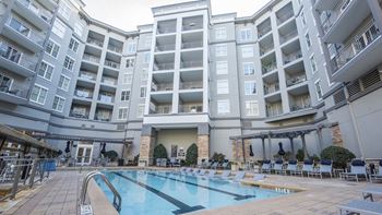 Pool courtyard with resort-style pool and lounge area