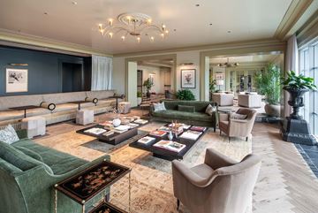 Arlington apartment for rent - A living room with a green sofa and a coffee table.