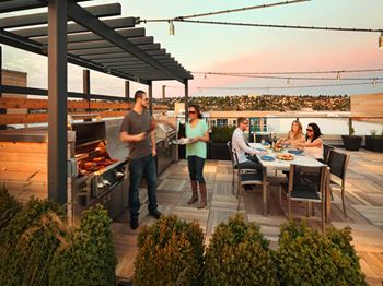 Rooftop grilling area with fireplace and 360 views
