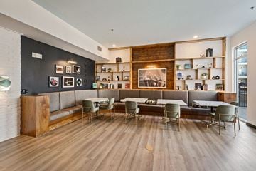 Austin apartment for rent - a living room with a couch and tables and chairs