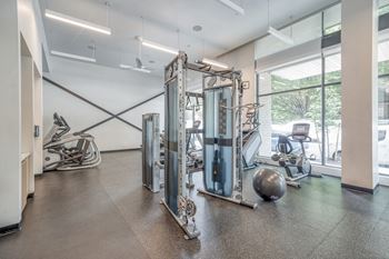 Hiit inspired fitness studio with trx bands, weight stations and cardio equipment