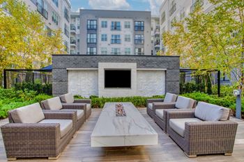 Grand two-story lobby with cozy seating area and gas fireplace