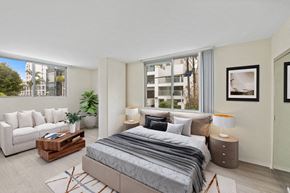 Santa Monica apartment for rent - a bedroom with a bed and a couch and other decorative furniture