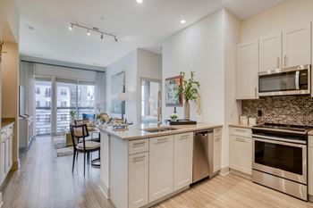 Gourmet kitchens with stainless steel appliances and kitchen islands