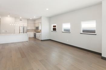 Luxury vinyl plank flooring in kitchen and living room