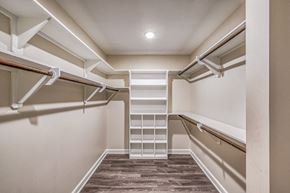 Houston apartment for rent - A spacious walk in closet with white shelves at The Sovereign at Regent Square, 3233 West Dallas, Houston, TX