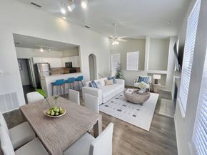 Tampa apartment for rent - Living room and kitchen with bright natural light at Windsor Highwoods Preserve apartments