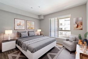 Dublin apartment for rent - A bedroom with a large bed and a window with curtains.