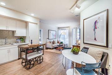 Fullerton apartment for rent - a living room with a kitchen and a dining table