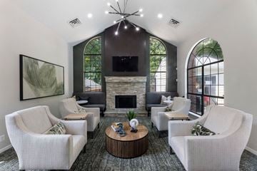 Fairfax apartment for rent - a living room with couches and chairs and a fireplace