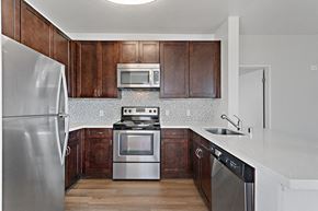 Oakland apartment for rent - Kitchen with stainless steel appliances at Allegro at Jack London Square in Oakland, CA