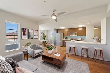 Los Angeles apartment for rent - a living room with a couch and a kitchen with a bar