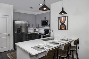Fitted kitchen with island dining