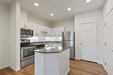 Redmond apartment for rent - A kitchen with white cabinets and stainless steel appliances.