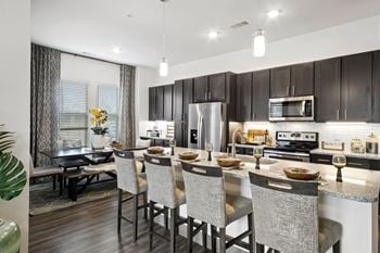 Spacious dining area and kitchen at windsor lakeyard district