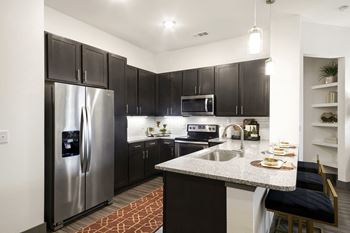 Kitchen with island at windsor lakeyard district