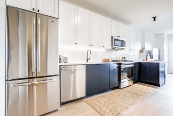 Ge® stainless steel appliances including refrigerator, gas ranges and built-in microwave