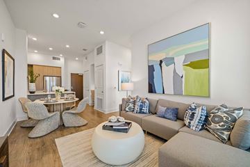 San Jose apartment for rent - A modern living room with a large abstract painting on the wall.