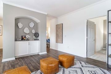 Kennesaw apartment for rent - A living room with a white cabinet and a rug on the floor.