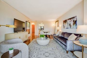 Edgewater apartment for rent - a living room with a couch and a table