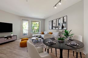 Dublin apartment for rent - A modern dining room with a black table set for four.