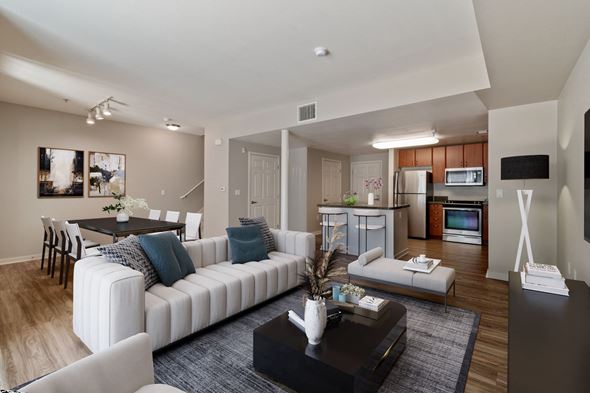 Dublin apartment for rent - A modern living room with a white sofa and a coffee table.