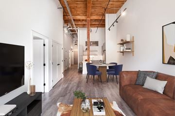 Melrose apartment for rent - a living room and dining area with a couch and a table