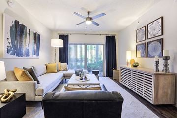 Delray Beach apartment for rent - a living room with a couch and a ceiling fan