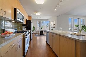 Los Angeles apartment for rent - a kitchen with wooden cabinets and stainless steel appliances and a counter top