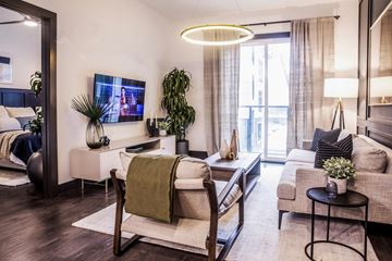 Atlanta apartment for rent - a living room with a couch and a chair and a tv