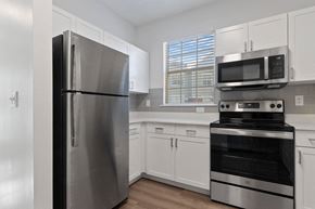 Atlanta apartment for rent - Kitchen with stainless steel appliances and white cabinets at Windsor Vinings, Atlanta, GA