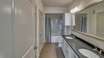 Dual vanities and large frameless glass showers*
