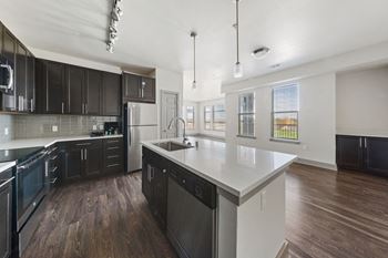 Custom espresso cabinetry with modern stainless hardware