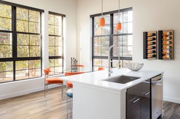 White quartz countertops with glass backsplashes