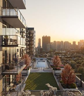 Chicago apartment for rent - A modern apartment complex with a pool and a view of the city skyline at sunset at Windsor North + Vine 633 W North Ave, Chicago, IL 60610.