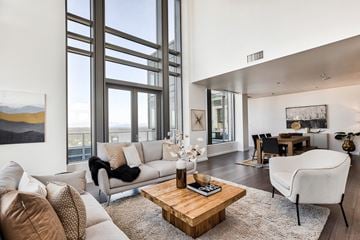 Bellevue apartment for rent - a living room with a couch and a coffee table and large windows