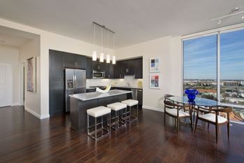 Upscale stainless appliance package including side by side refrigerators
