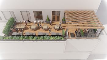 Elevated outdoor living space with multiple grills and dining area