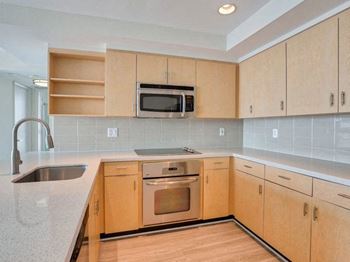 Gourmet kitchens with refrigerators, dishwashers, built-in microwaves