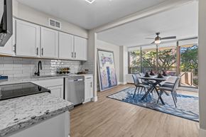 Southfield apartment for rent - A modern kitchen with a dining table set up.