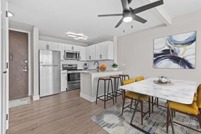 Southfield apartment for rent - A modern kitchen with a dining table and chairs.