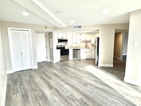 Aurora apartment for rent - A spacious kitchen with a dining area and a living room.