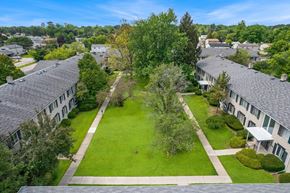 Southfield apartment for rent - A bird's eye view of a green lawn surrounded by buildings.