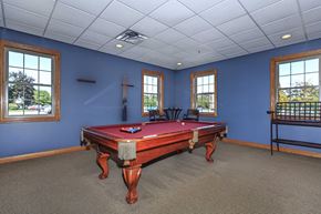 Cuyahoga Falls apartment for rent - A pool table in a room with blue walls and carpet.