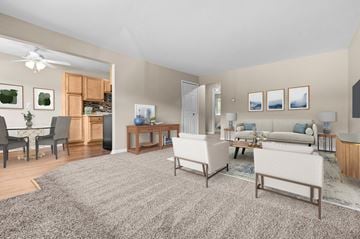 South Lyon apartment for rent - A living room with a grey carpet and furniture.