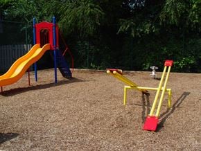 Decatur apartment for rent - A playground with a yellow slide and a red and blue slide.